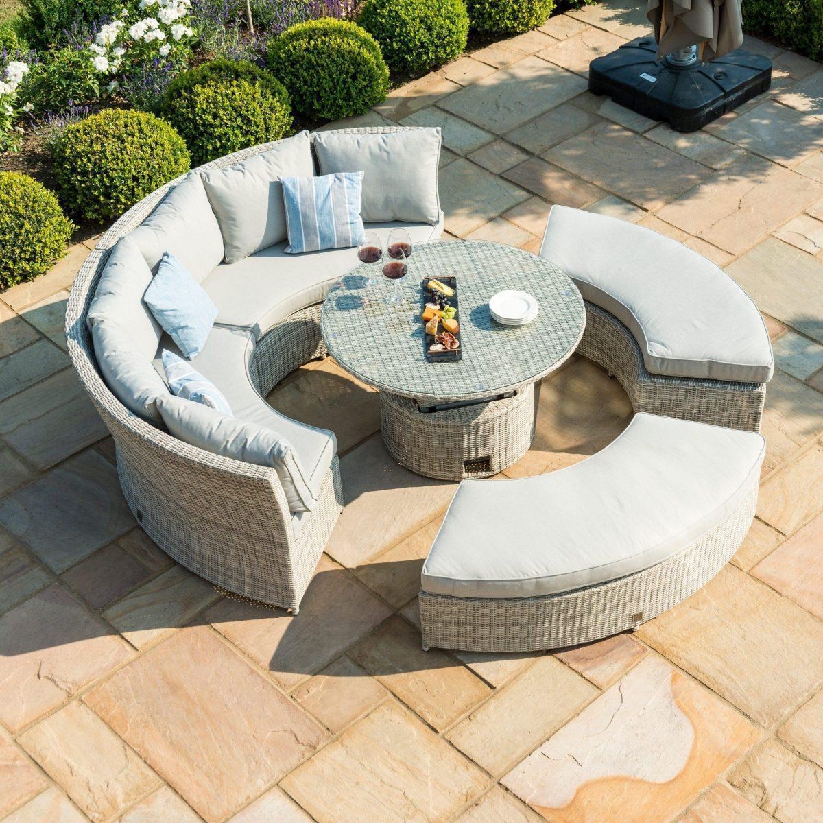 Curved Sectional Sofa Featuring Rising Pedestal Table and Benches