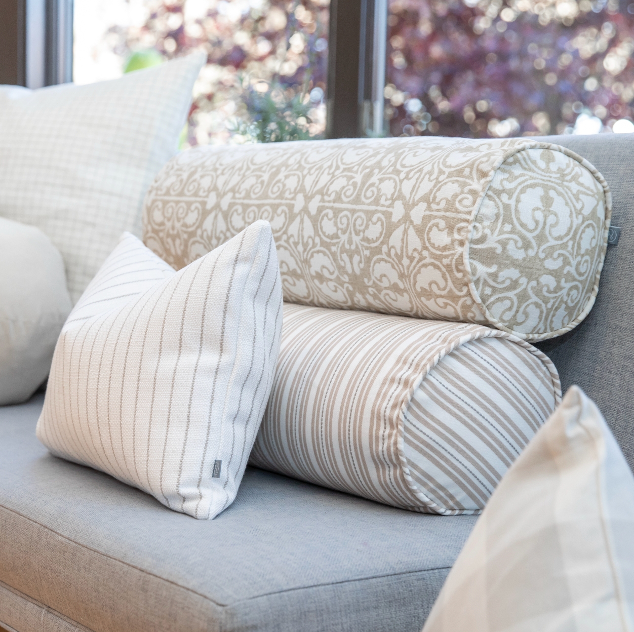 Decorative Pillows with Bolster Cushion in Sand Dollar