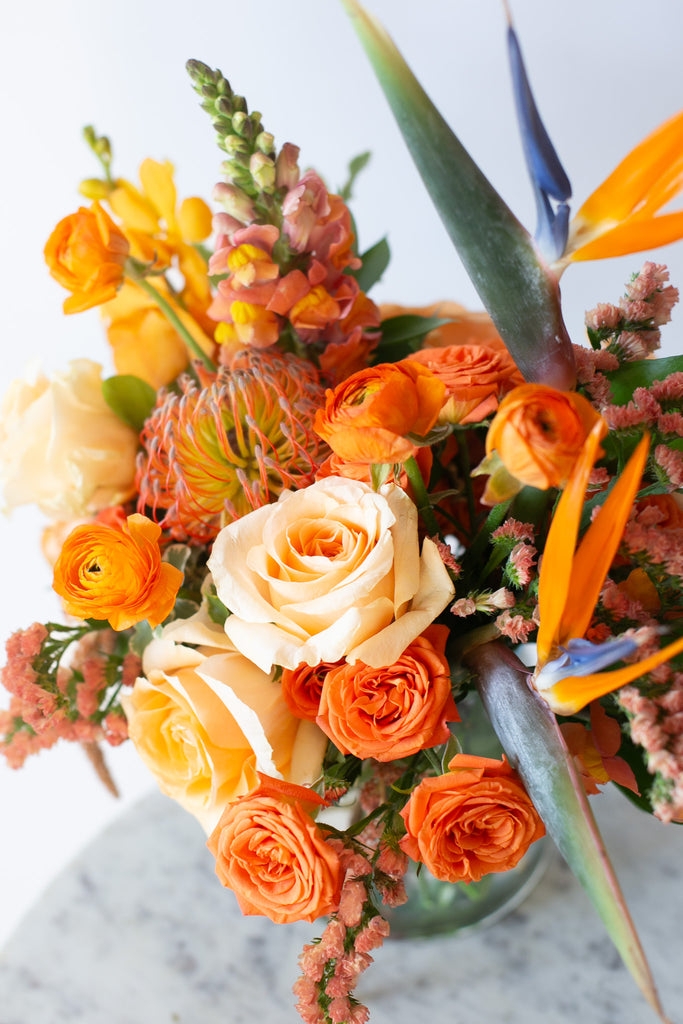 Floral Arrangement in Monochromatic Orange with Bird of Paradise