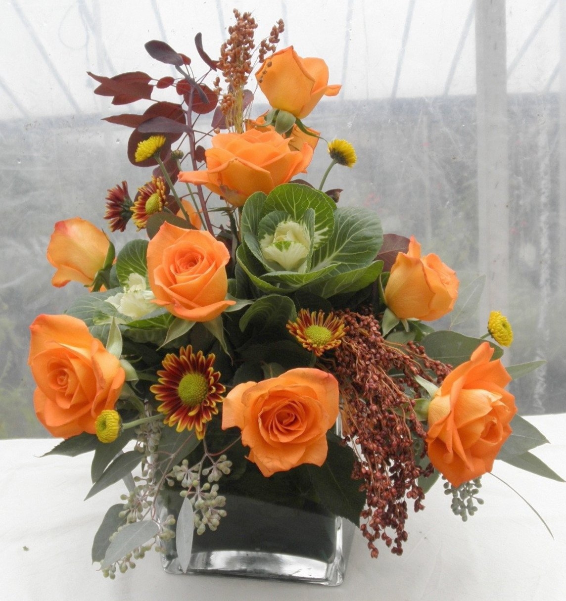 Floral Arrangement with Ornamental Kale Center and Square Vase