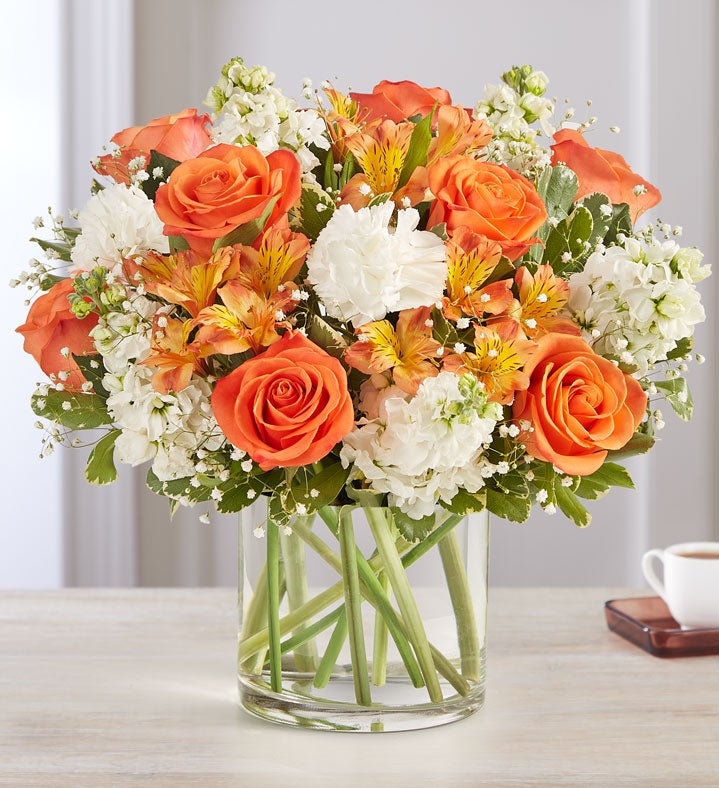 Floral Arrangement with Variegated Foliage and Orange Roses
