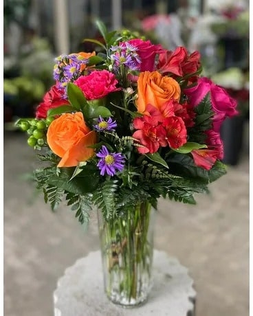 Flower Arrangement in Ribbed Cylindrical Vase with Berries