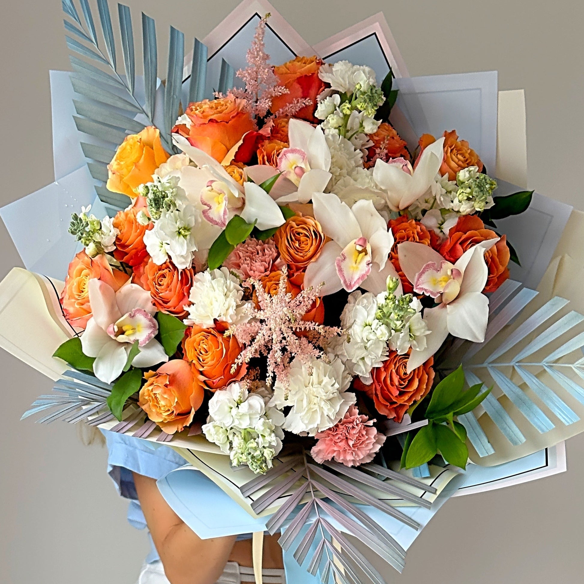 Flower Bouquet featuring Blue Palm Accents and Exotic Orchids