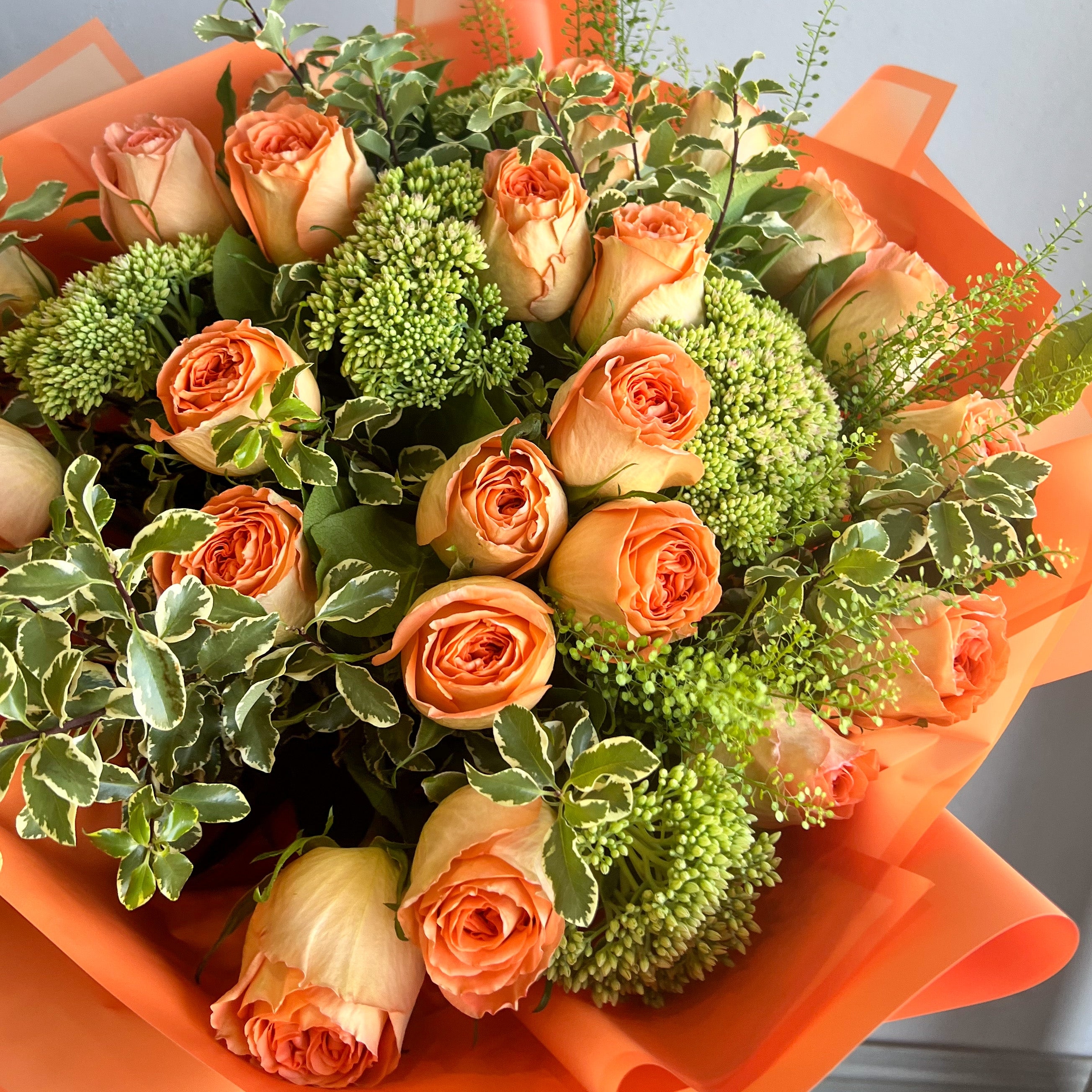 Flower Bouquet with Textural Green Fillers and Peach Roses