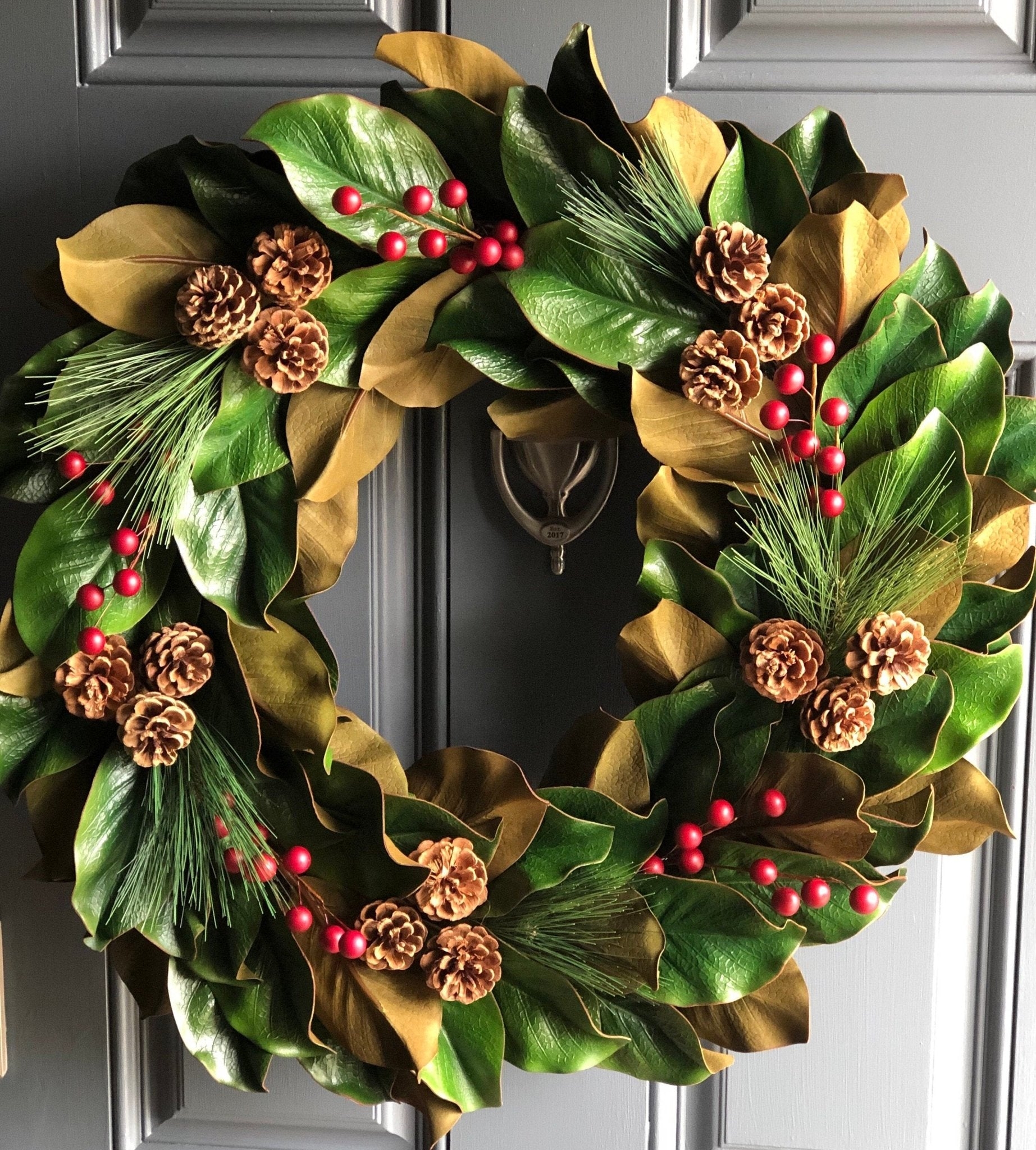 Holiday Wreath with Pinecone Accents and Red Berry Decor