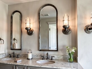 Industrial Wall Sconce: Caged Glass with Pipe Fitting Detail