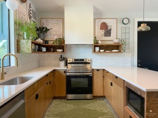 Kitchen Cabinetry With Black Semi-Circle Hardware and Star