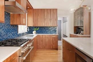 Kitchen Cabinetry With Cobalt Blue Backsplash and Walnut Grain