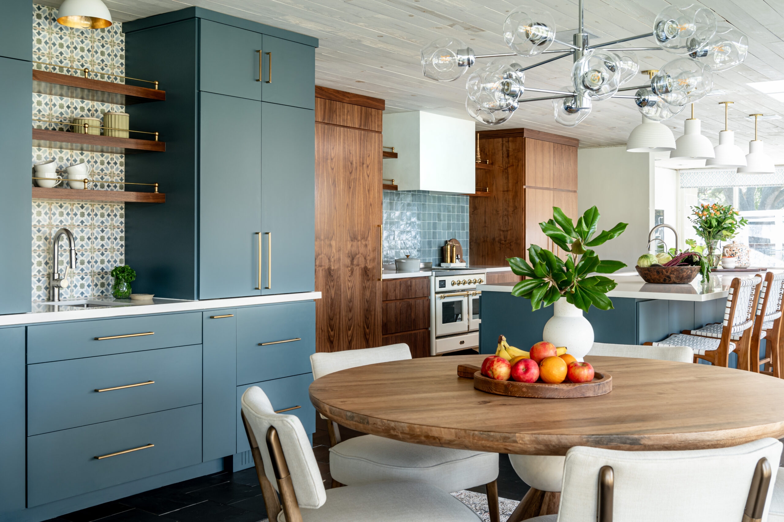 Kitchen Dining Space With Slate Blue Cabinetry and Walnut