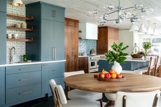 Kitchen Dining Space With Slate Blue Cabinetry and Walnut