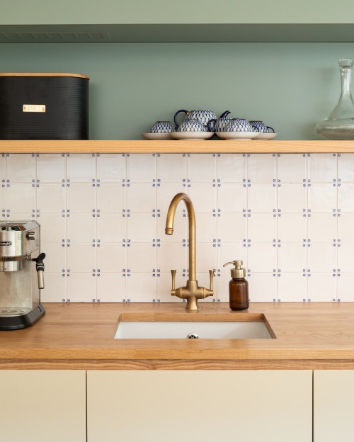 Kitchen Faucet: Blue Cross Tile with Brass Bridge Hardware