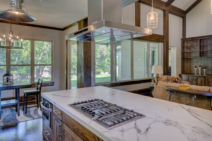 Kitchen Island with Integrated Gas Range and Veined Stone