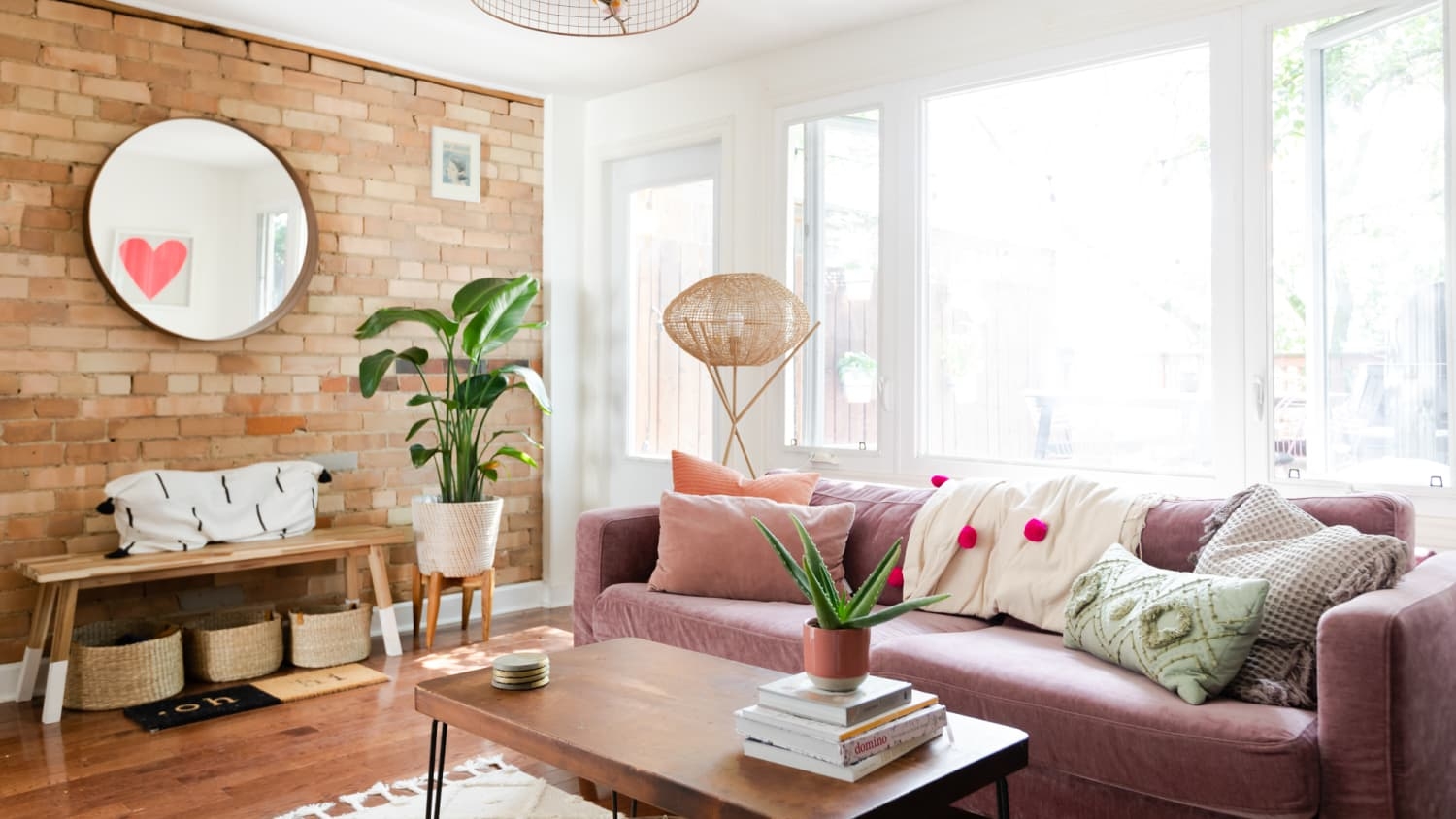 Lounge Sofa - Exposed Brick Decor with Mauve Velvet Seating
