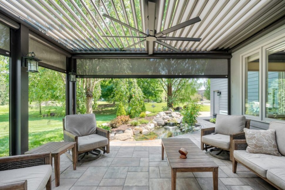 Louvered Pergola Featuring Retractable Screens and Fan