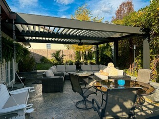 Louvered Pergola With Adjustable Slats and Integrated Fan