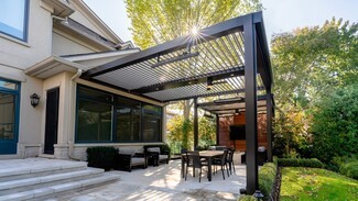 Louvered Pergola With Integrated Heating and Black Frame