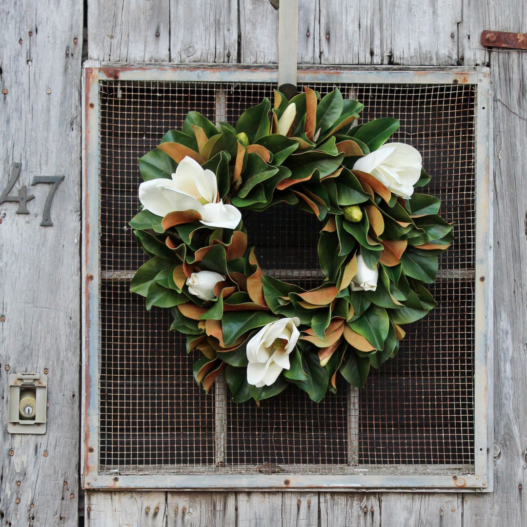 Magnolia Wreath on Barn Door Backdrop with White Blossoms