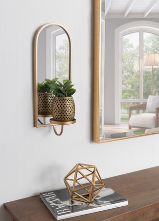 Mirror Sconce: Arched Brass-Toned Frame with Integrated Shelf