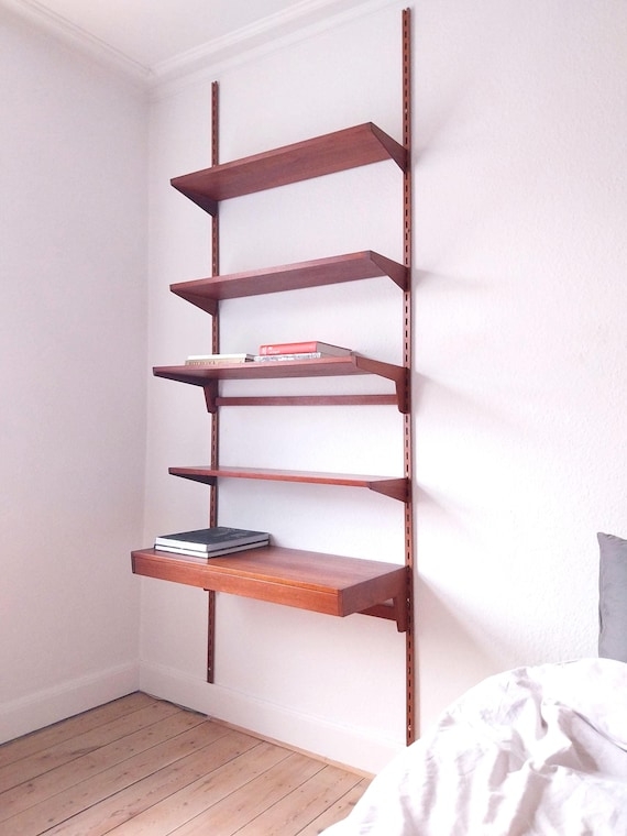 Modular Shelving Featuring Integrated Desk and Wall Rails