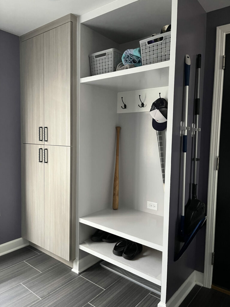 Mudroom Built In: Vertical Grain Cabinets On Charcoal Wall