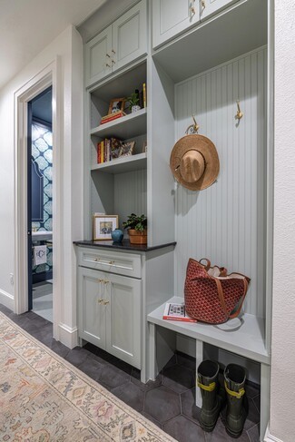 Mudroom Built In with Sage Green Paint and Brass Hooks