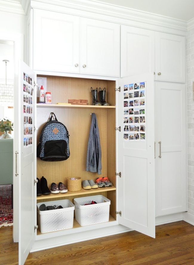 Mudroom Cabinet with Wood-Toned Interior and Photo Display