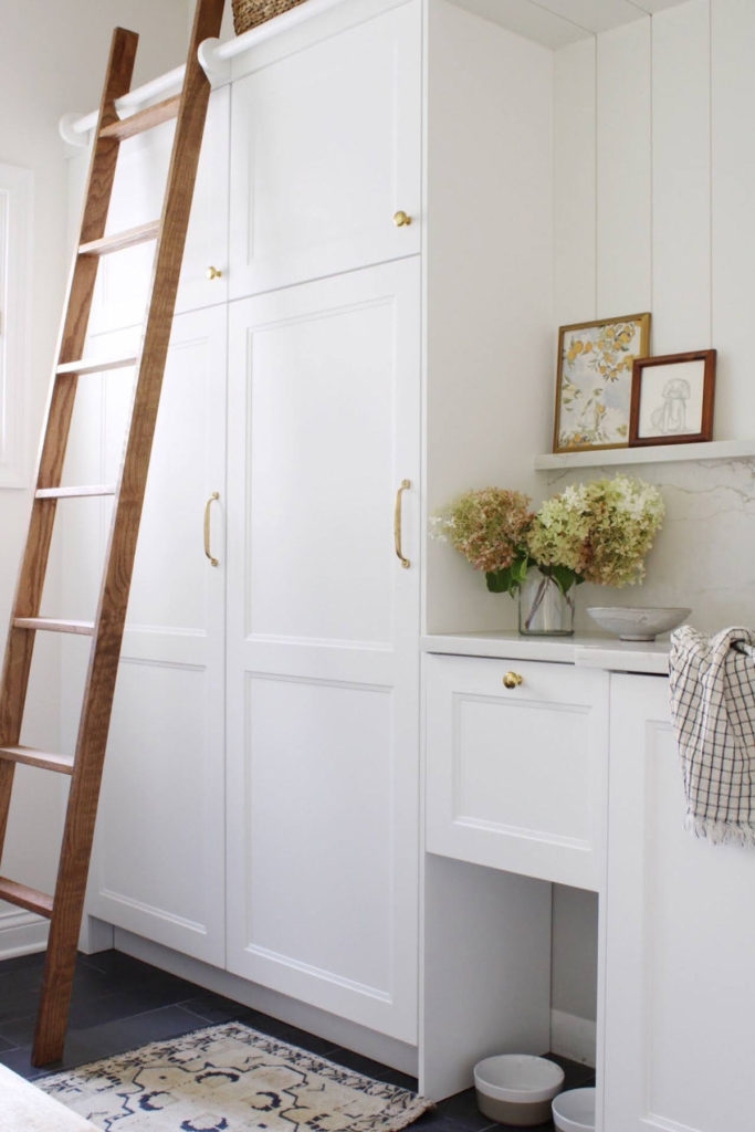 Mudroom Cabinetry: Sliding Library Ladder Storage Cabinet