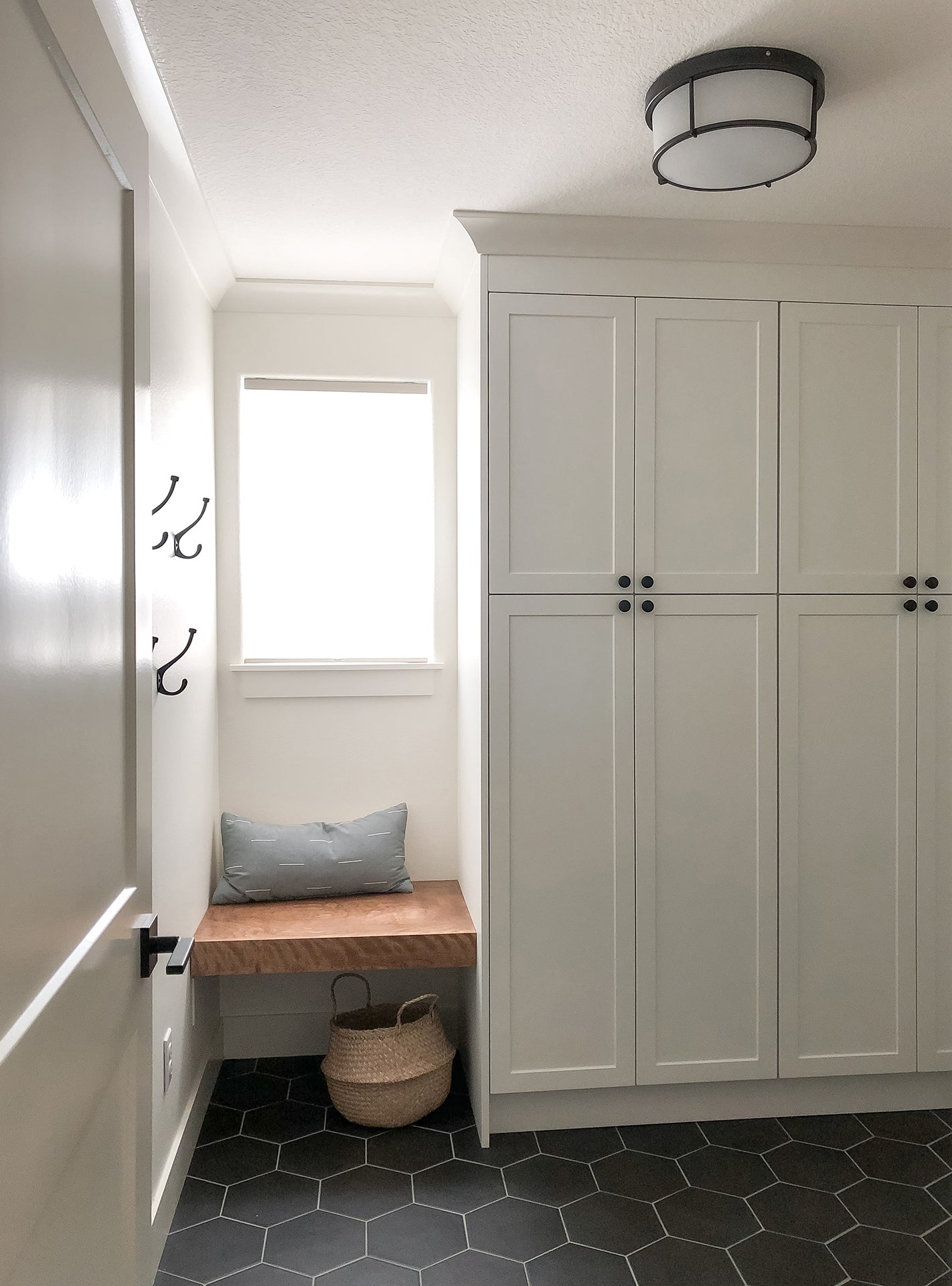 Mudroom Cabinetry with Hexagonal Flooring and Shaker Doors