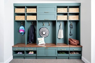 Mudroom Cabinetry with Teal Paint Finish and Walnut Bench