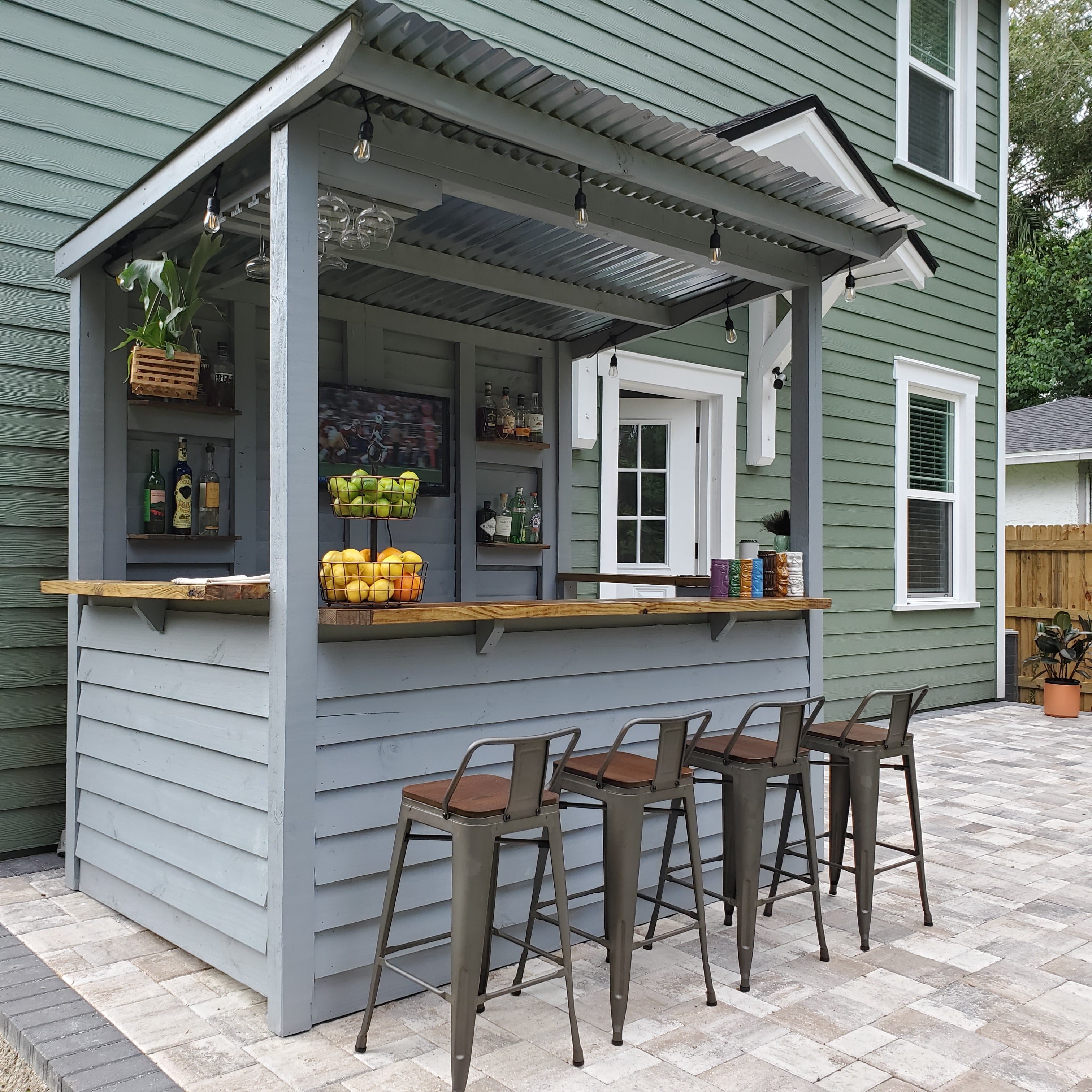 Outdoor Bar with Grey Lap Siding and Corrugated Roof