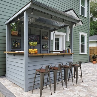 Outdoor Bar with Grey Lap Siding and Corrugated Roof