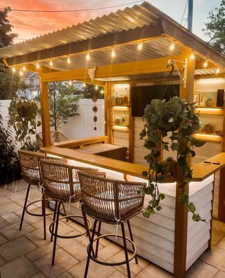 Outdoor Bar with LED Lighting and Corrugated Metal Roof