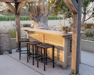 Outdoor Bar with Slatted Panels and L-Shaped Countertop