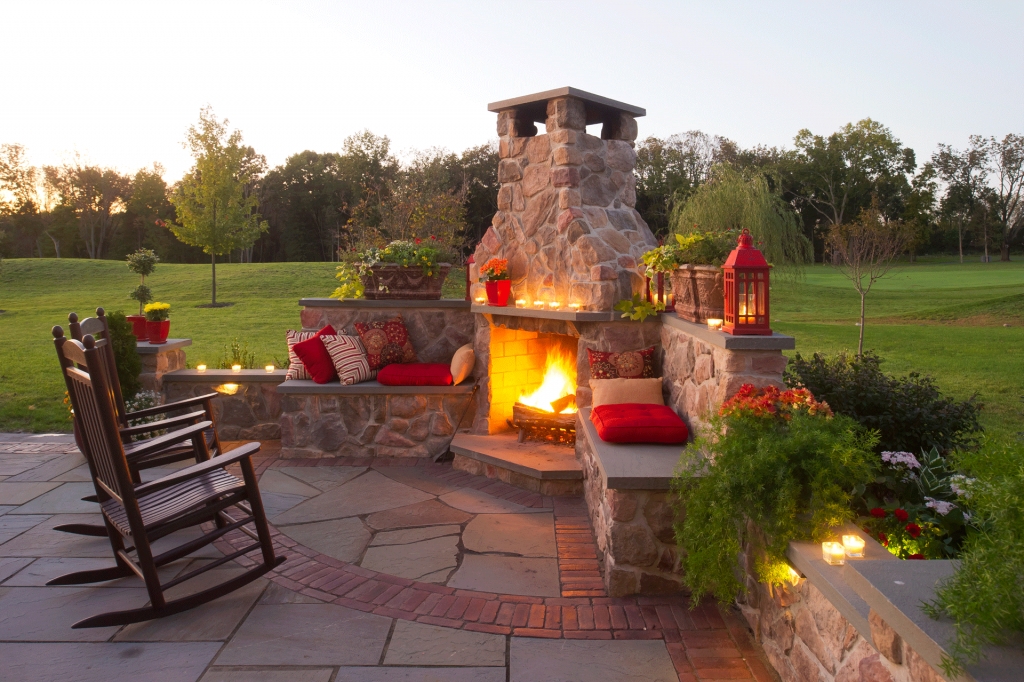 Outdoor Fireplace Seating with Flagstone Flooring and Pillows