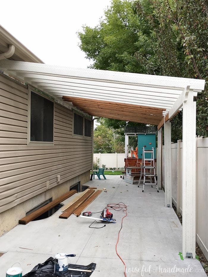 Patio Pergola With Slatted Wood Canopy and Wall Attachment