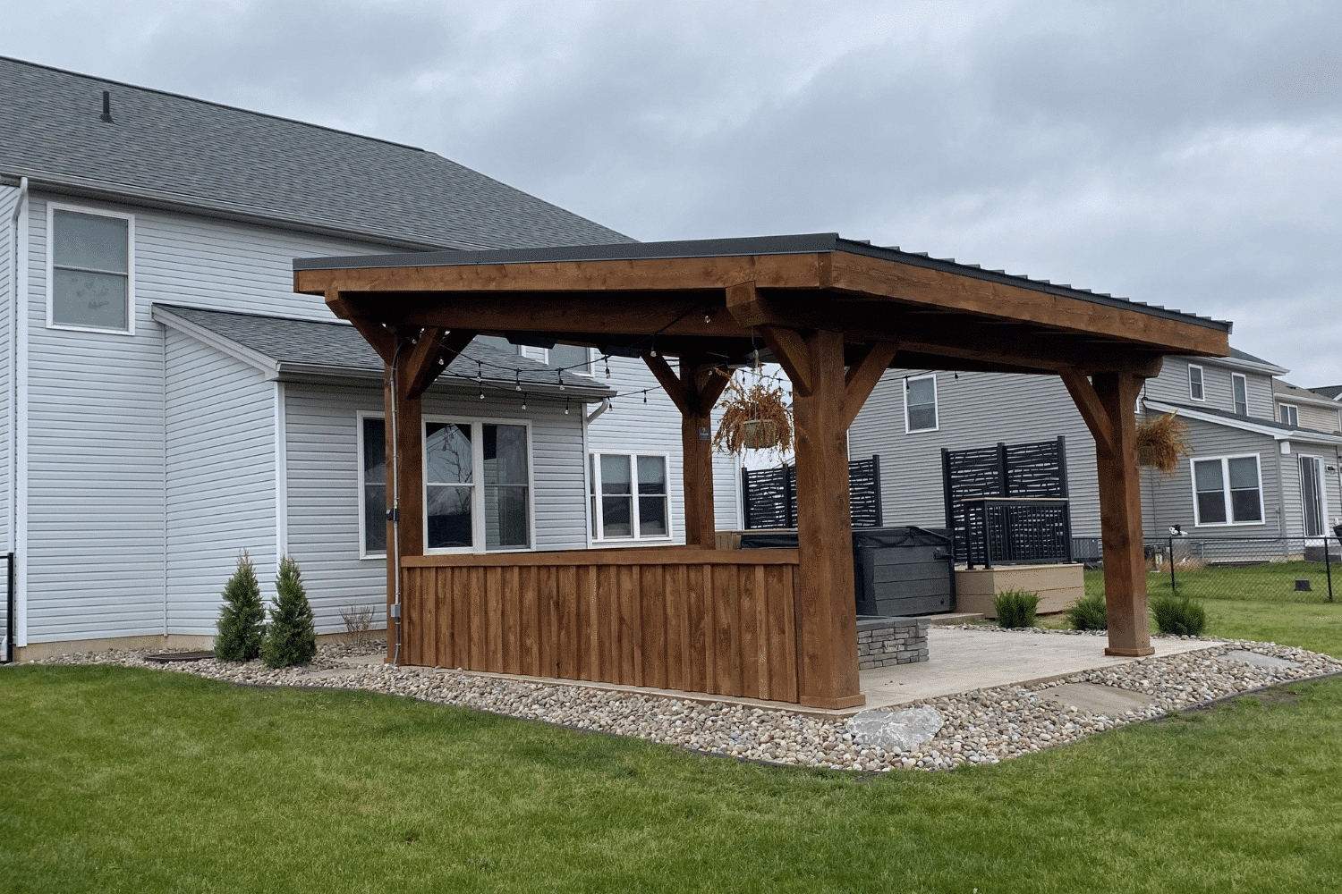 Pavilion: Integrated Privacy Wall Walnut Outdoor Lounge