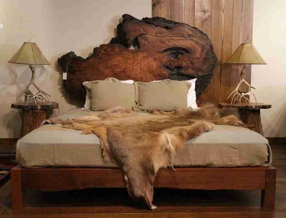 Platform Bed with Burl Wood Slab and Antler Lamp Styling