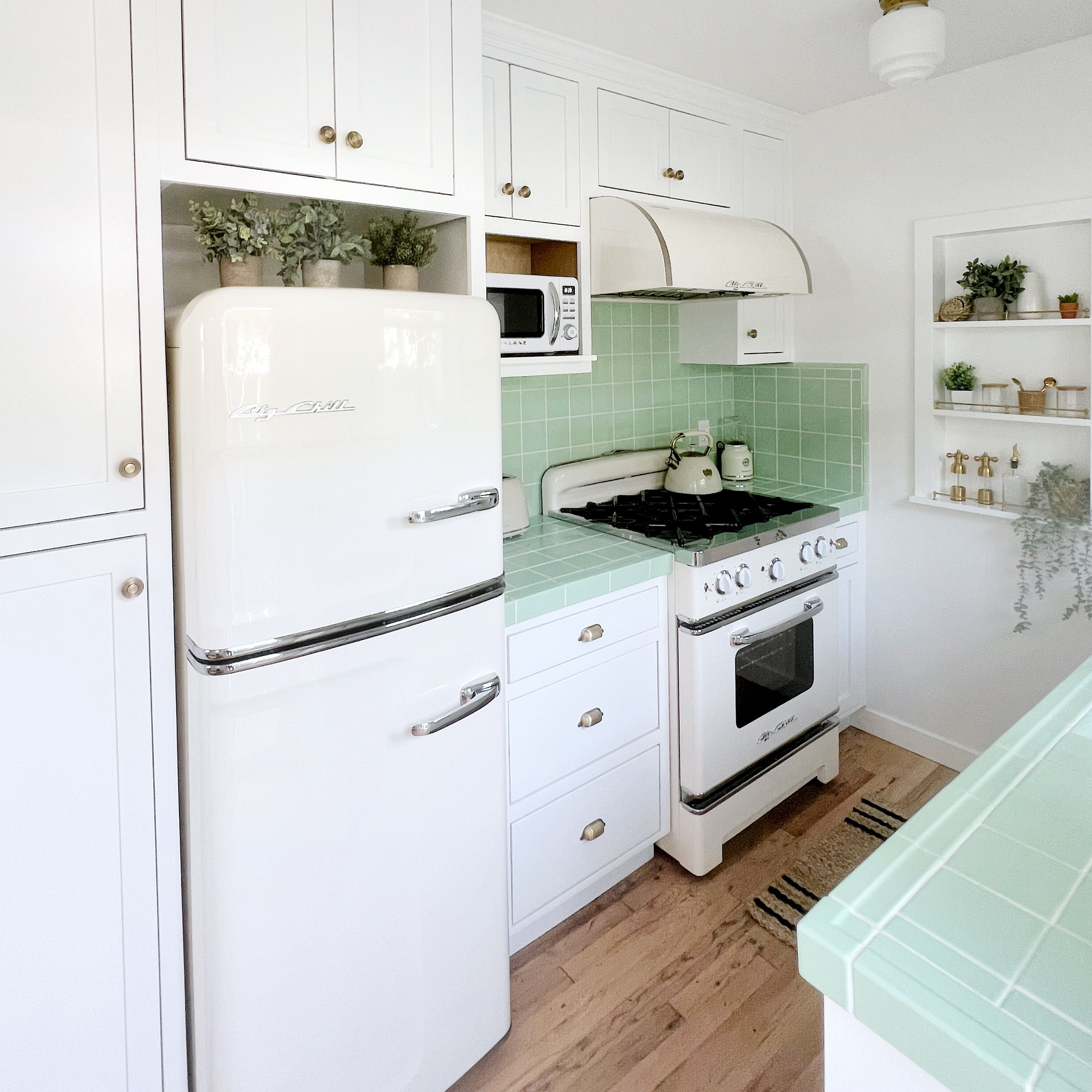 Retro Kitchen: Mint Green Countertops and Cream Appliances