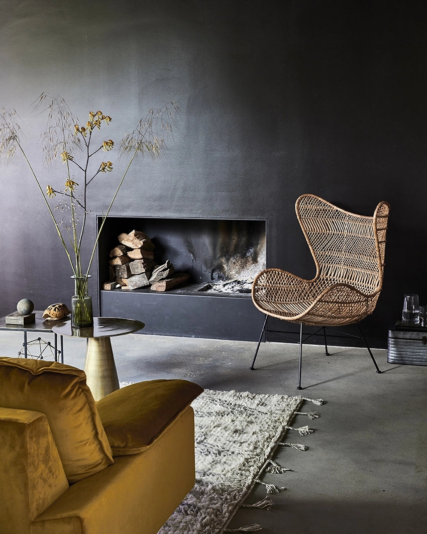 Retro Sofa: Ochre Velvet Seating in Moody Black Living Room