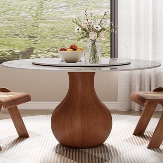Round Dining Table displaying Vase Pedestal and Marbled Top