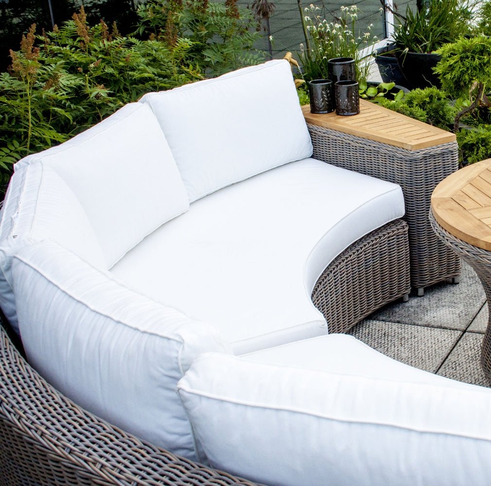 Rounded Outdoor Sofa with Curved Silhouette and Side Table