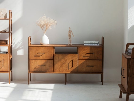 Sideboard with Raised Side Frames and Sliding Door Design