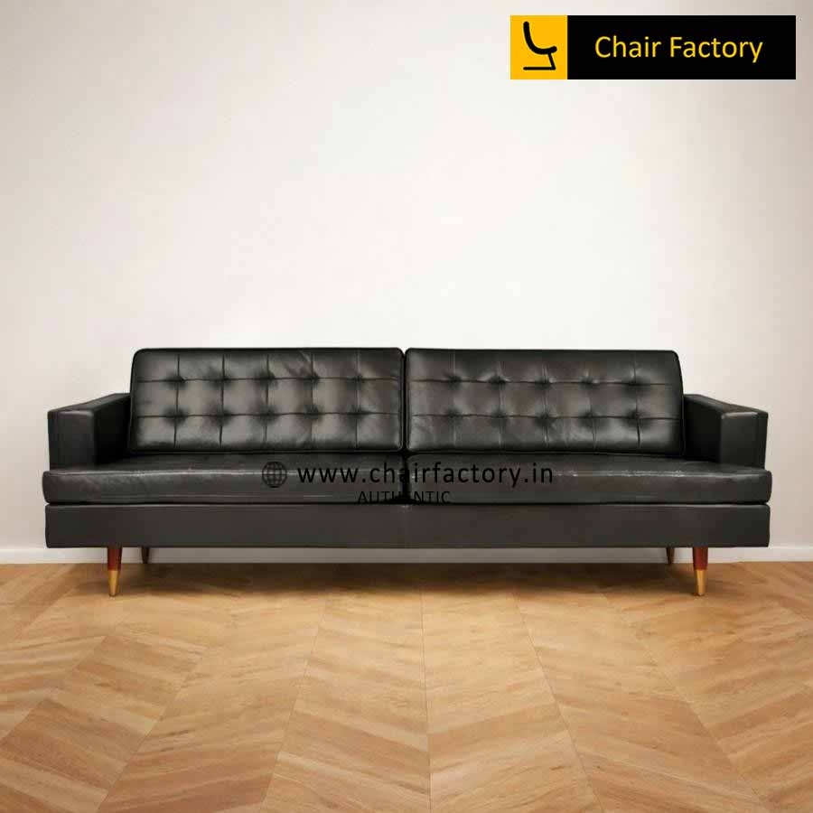 Sofa with Brass Tone Caps and Leather Like Mid Century Design