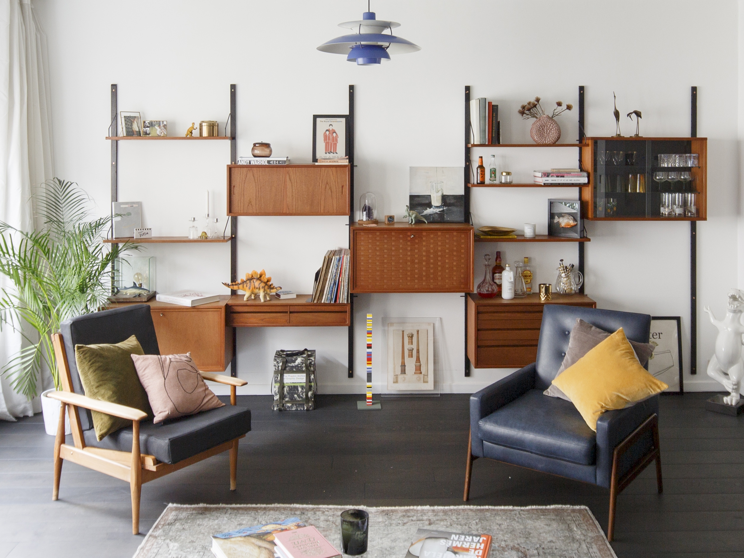Wall Mounted Shelving With Tiered Pendant Light Styling