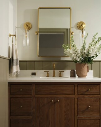 Wall Sconce: Sage Green Wainscoting and Cylindrical Glass