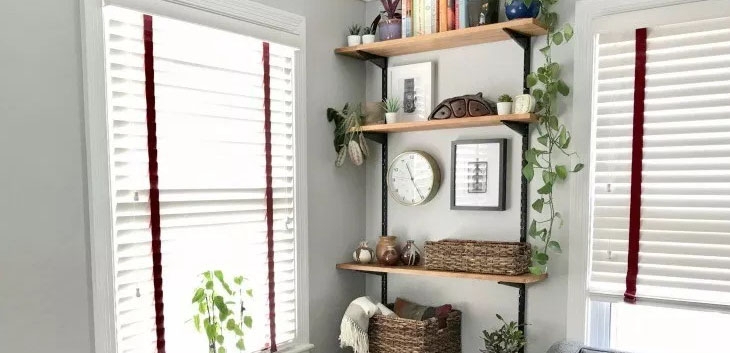 Wall Shelving With Slotted Metal Tracks and Mixed Decor