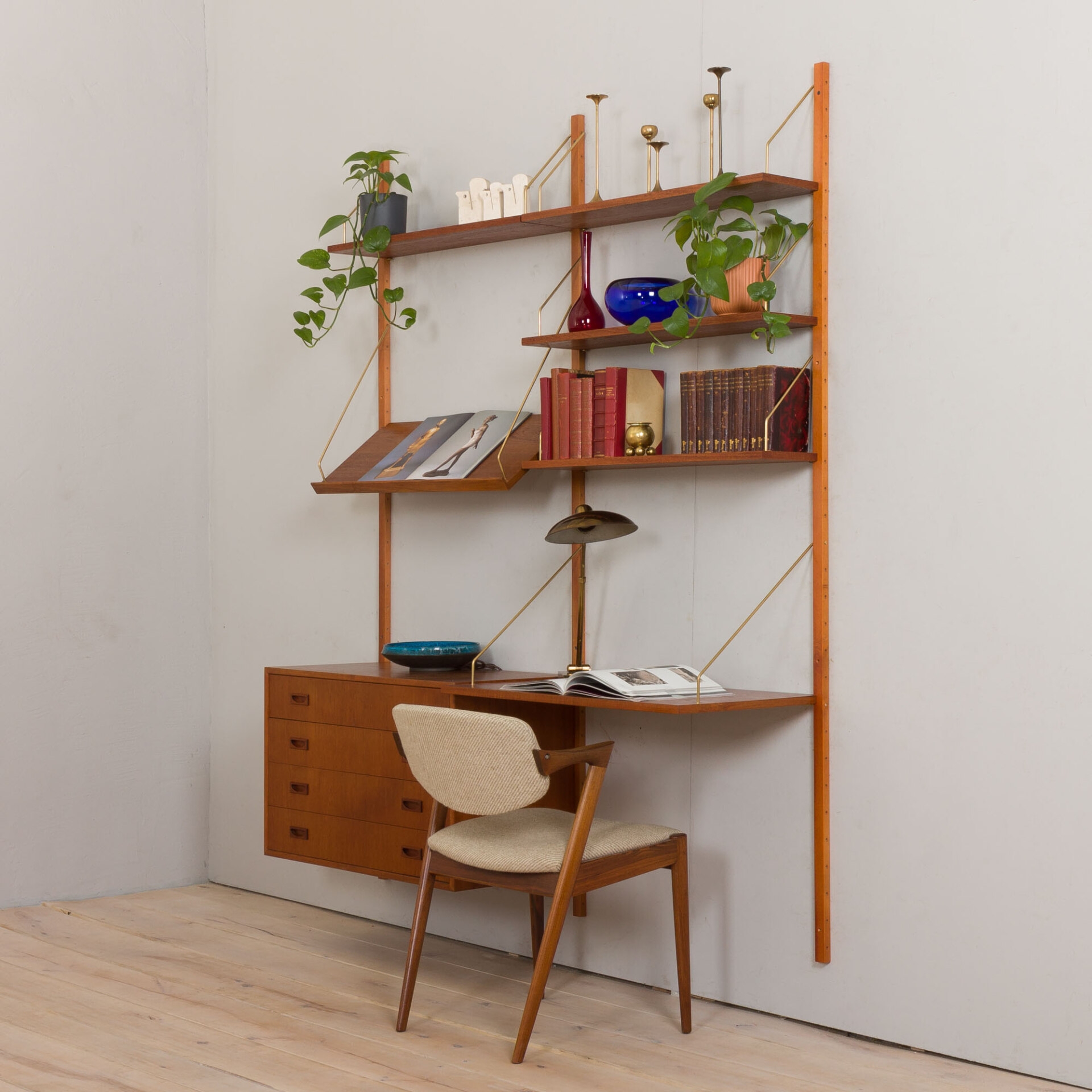 Wall Unit Offering Two Bay Configuration and Brass Rods