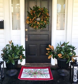 Wreath with Symmetrical Urns and Black Front Door Styling