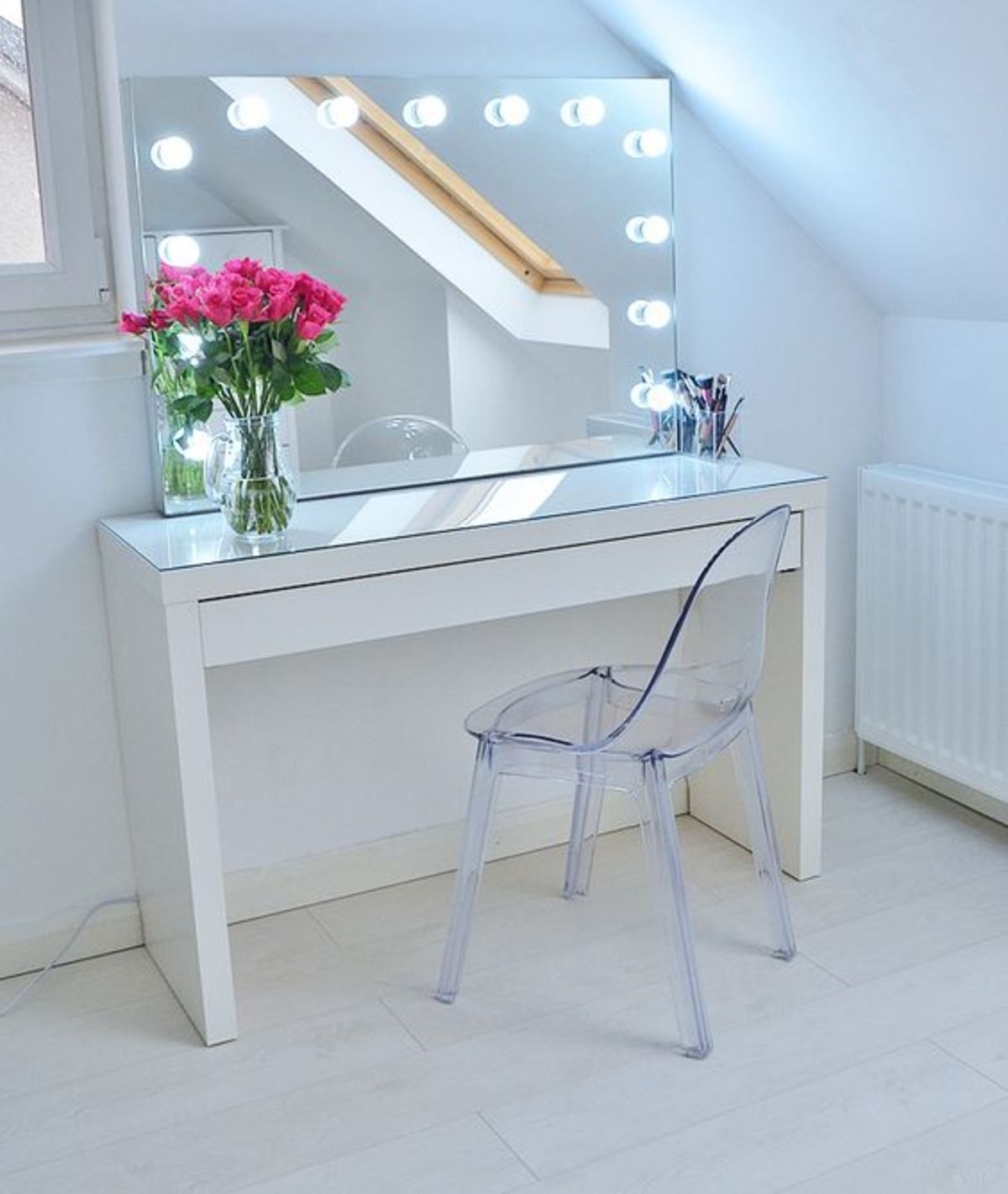 small vanity table with mirror and lights